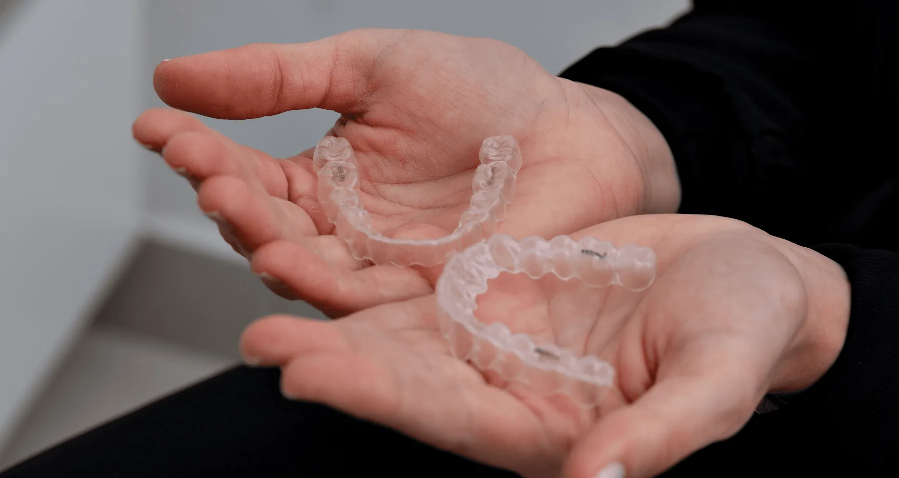 Clear aligners in hand, designed in Germany